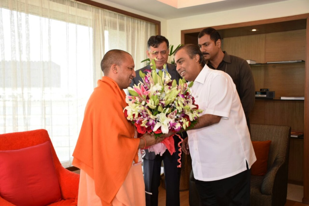 Industralist Mukesh Ambani Shaking hands with CM, Yogi