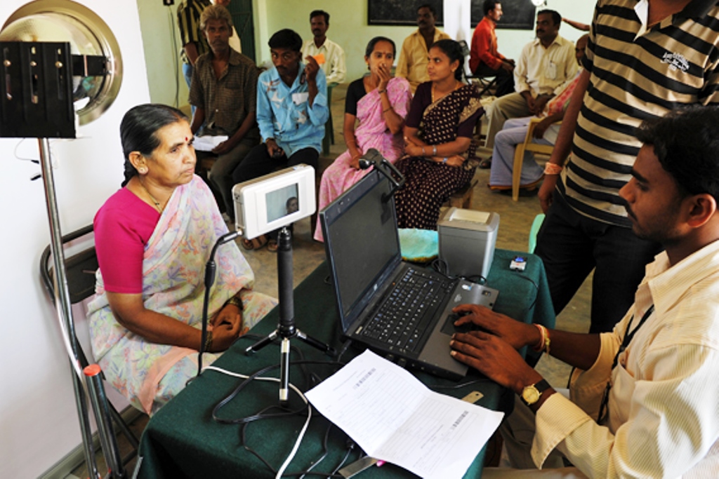 An Indian villager looks at an iris scanner during the data collecting process for a pilot project of The (UIDAI)